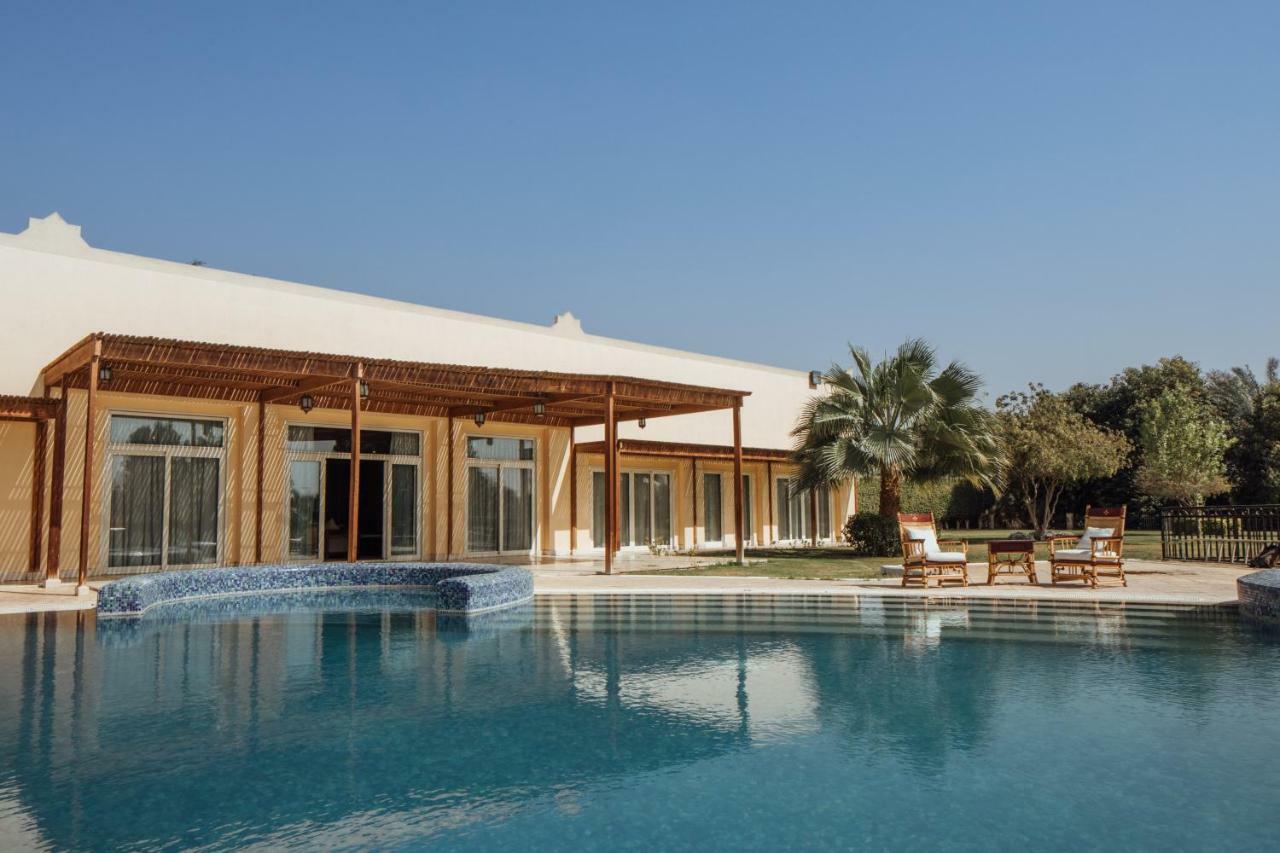 Jolie Ville Hotel & Spa Kings Island Луксор Экстерьер фото The resort's swimming pool