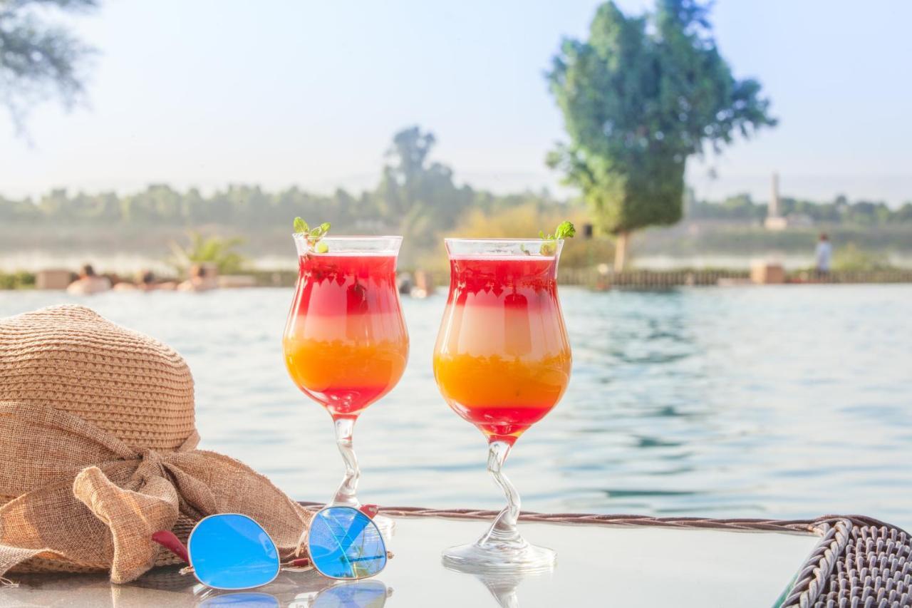 Jolie Ville Hotel & Spa Kings Island Луксор Экстерьер фото A layered strawberry and mango drink