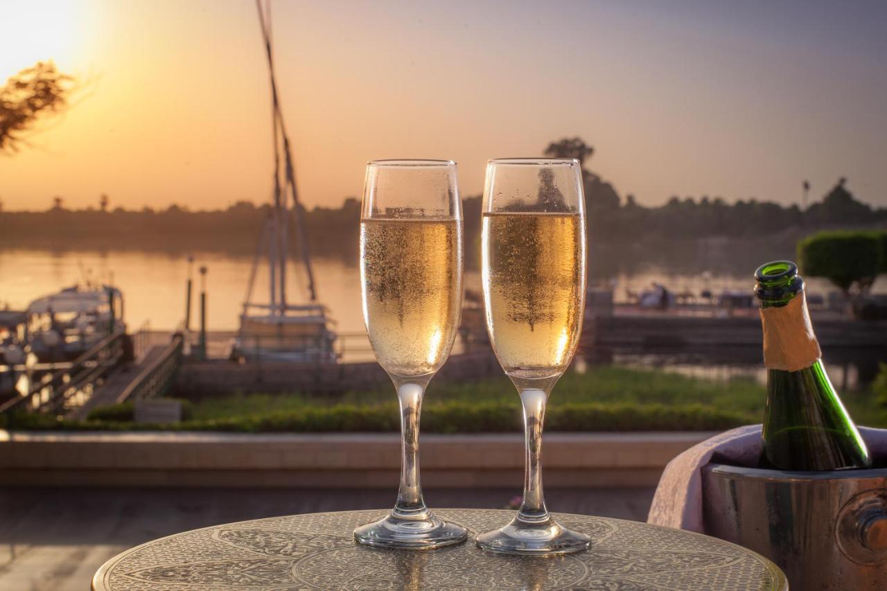 Jolie Ville Hotel & Spa Kings Island Луксор Экстерьер фото Two champagne flutes