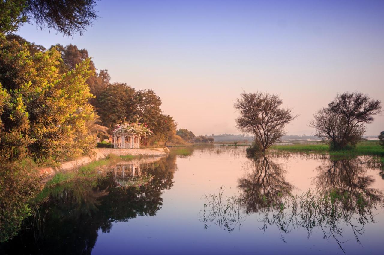 Jolie Ville Hotel & Spa Kings Island Луксор Экстерьер фото The river at sunset